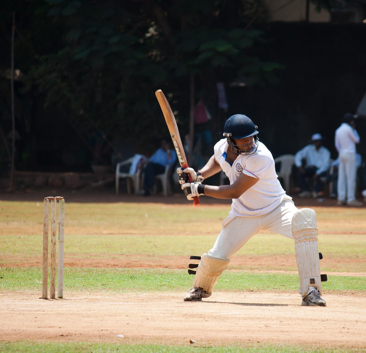 Cricket batsman mid-stroke in action — live cricket betting on 4SIX Bangladesh